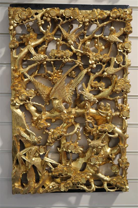 A set of six Chinese carved giltwood panels of birds amid prunus